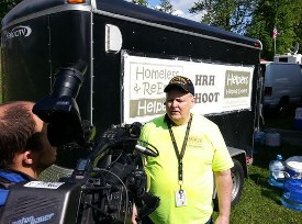 Don Hawkins being interviewed by the press